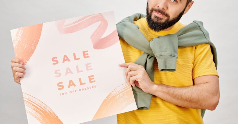 Man holding a sale poster advertising 20% off dresses. Perfect for Black Friday promotions.